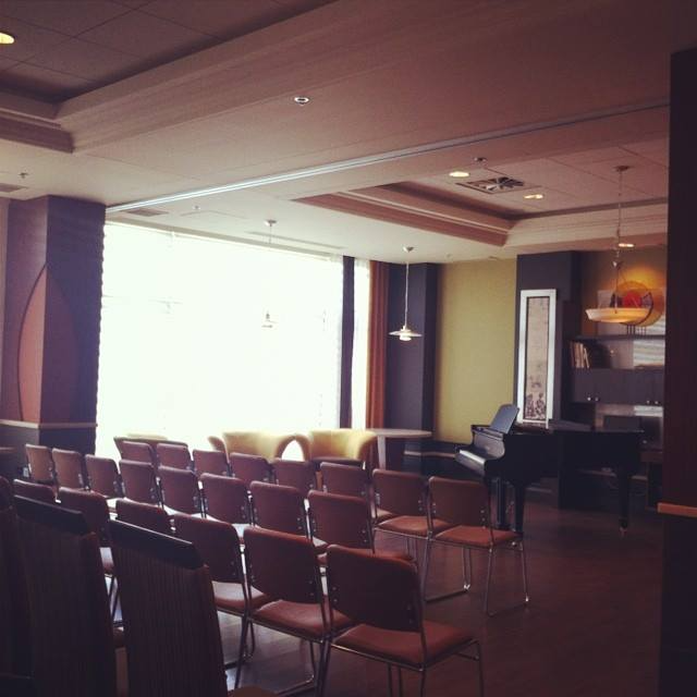 Nursing home entertainment room with a grand piano